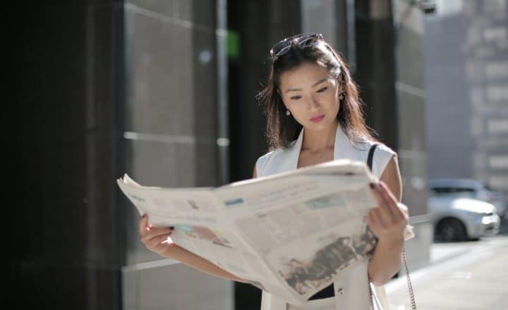 Canva Photo Of Woman Holding Newspaper 720x440