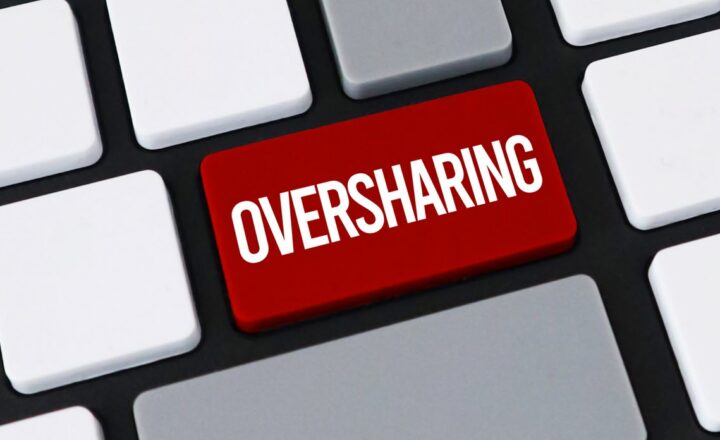 Red keyboard key labeled Oversharing, illustrating SharePoint oversharing risk