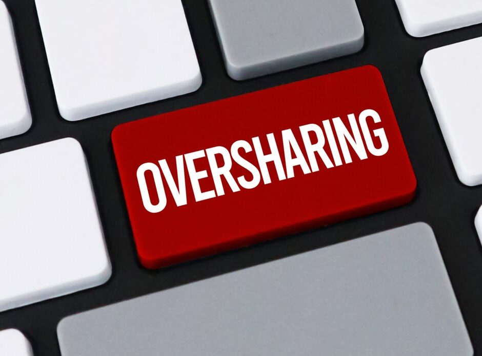 Red keyboard key labeled Oversharing, illustrating SharePoint oversharing risk